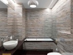 Интерьер ванной комнаты с облицовкой серым камнем